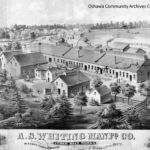 Black and white drawing of a manufacturing plant, with several large buildings
