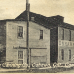 Sepia photograph of a building with a sign reading Oshawa Canning Company