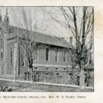 Black and white image of a brick church