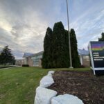 Colour photograph of a brick and glass building. There is a sign reading John Aker Northview Branch, Oshawa Public Libraries