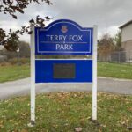 Colour photo of a blue sign for Terry Fox Park