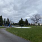Colour photo of a playground and park space